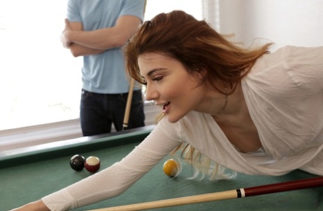 Молоденькая рыжеволосая красотка трахается с большим членом на бильярдном столе 2